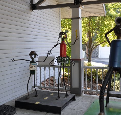 Two sculptures who appear as if they are holding hands at the entrance to the Vanessa Behan Crisis Nursery.